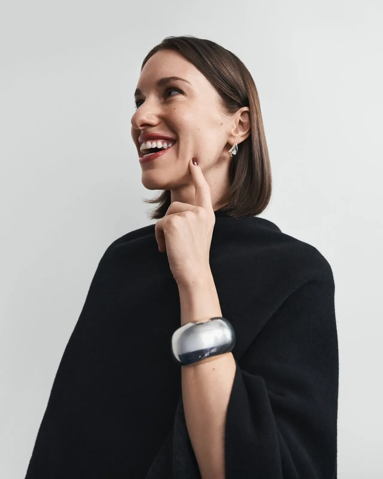 Laura Reilly Showcases Reversible Draped Poncho for Effortless Style