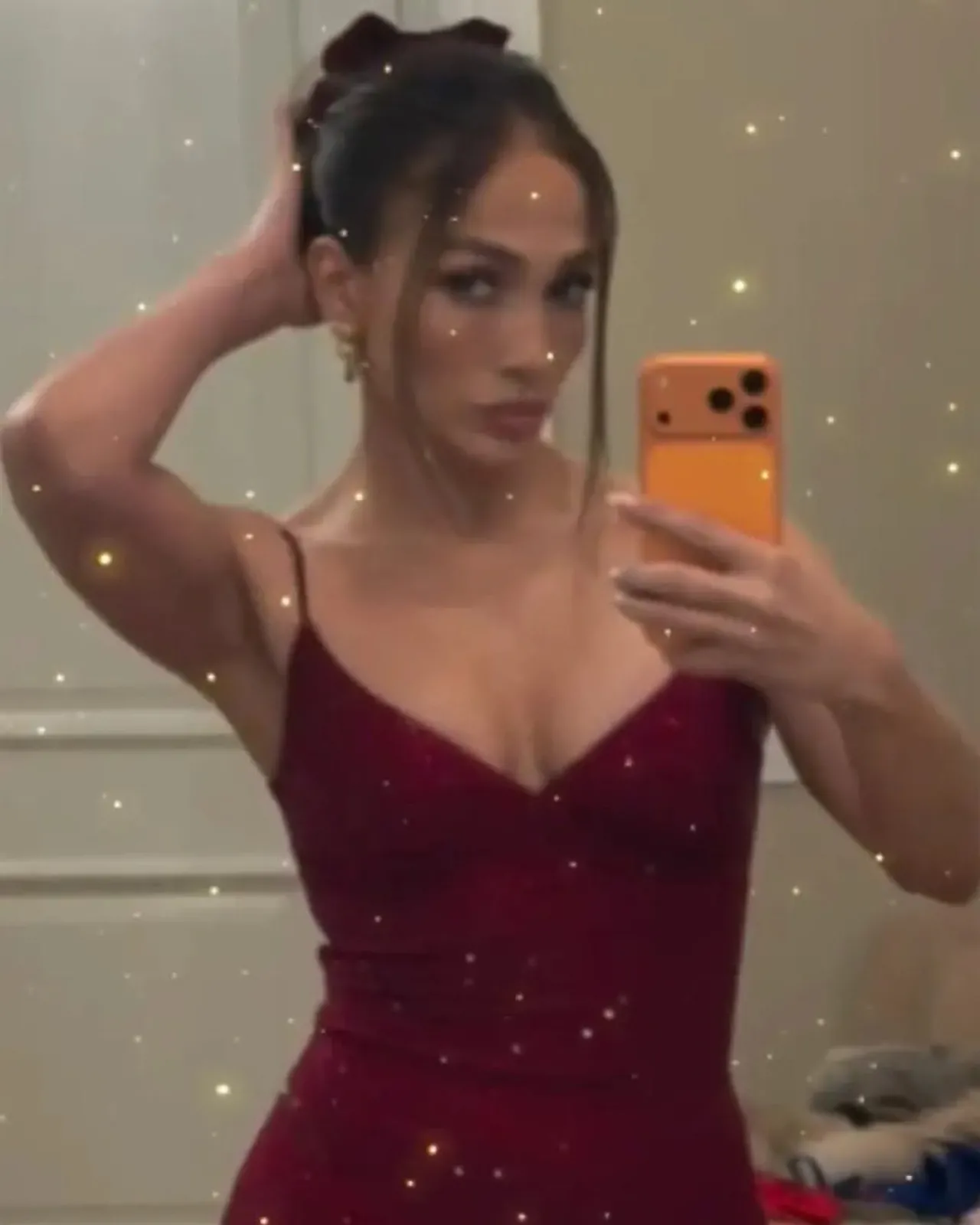 Jennifer Lopez Shines in Crystal-Covered Burgundy Gown for Festive Christmas Celebration